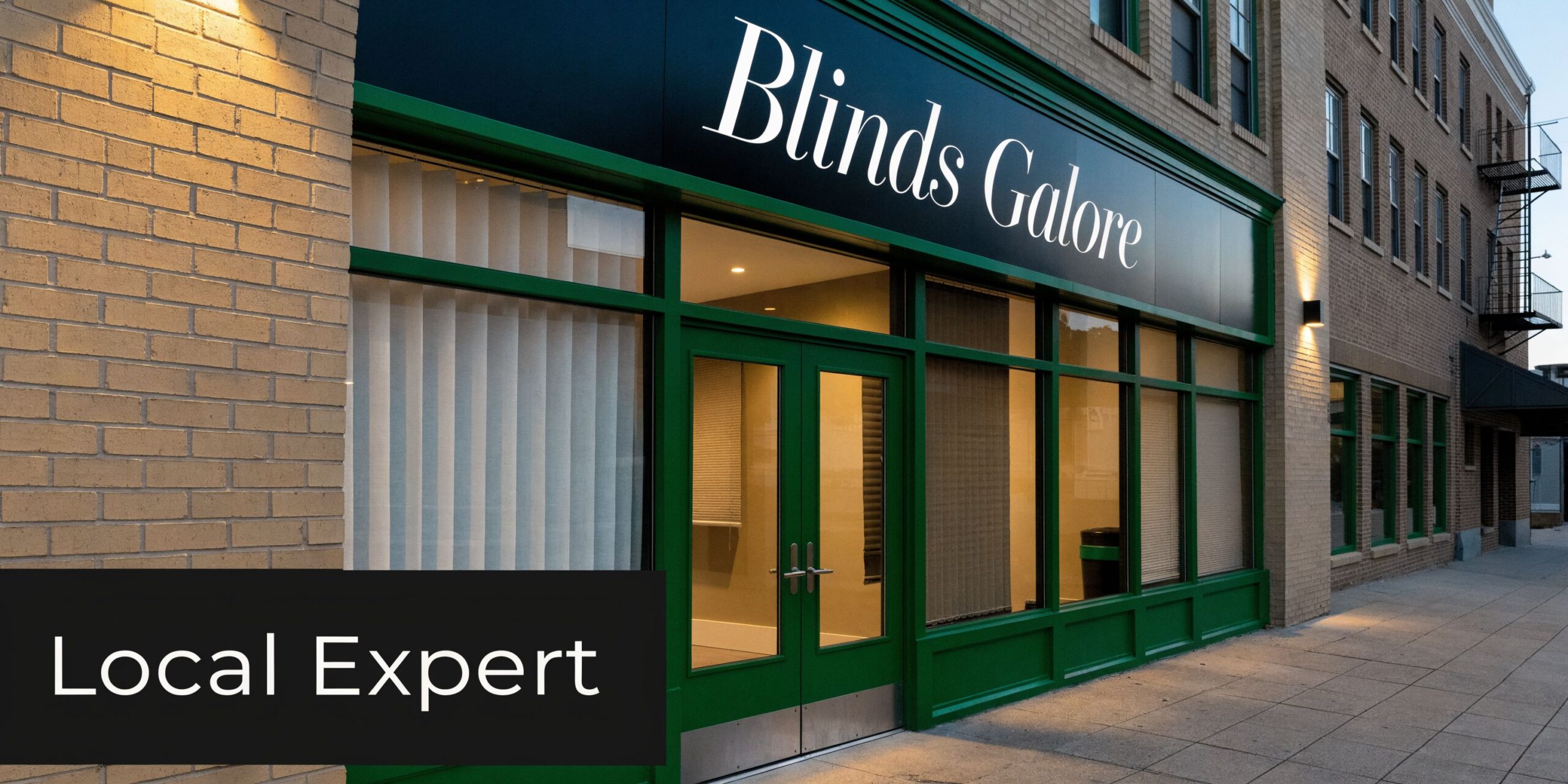 Storefront of Blinds Galore, a shop specializing in window coverings, located on a brick sidewalk.