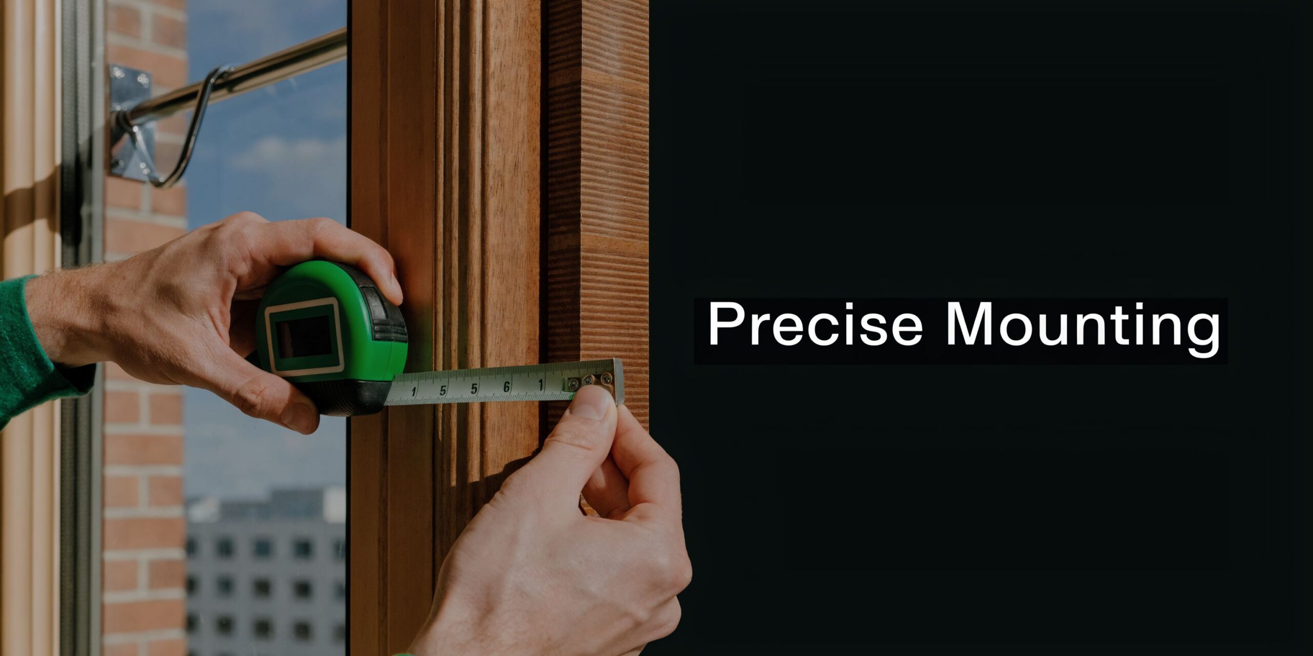 A professional carpenter uses a tape measure to take precise measurements of a wooden window frame.
